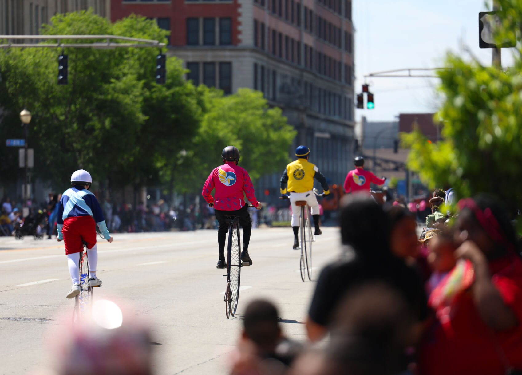 People ride bicycles at Pegasus Parade.JPG